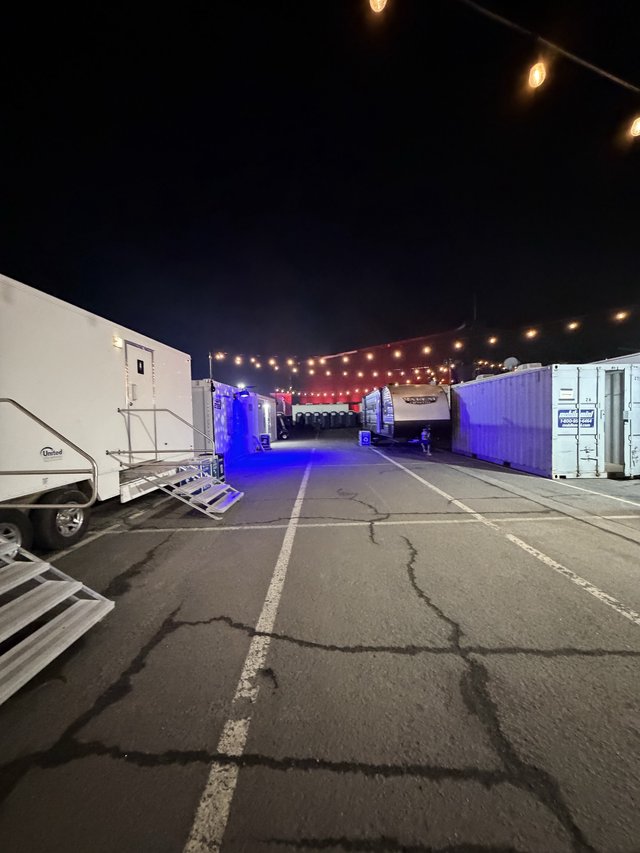 Concert Venue Setup at Dawn with String Lights