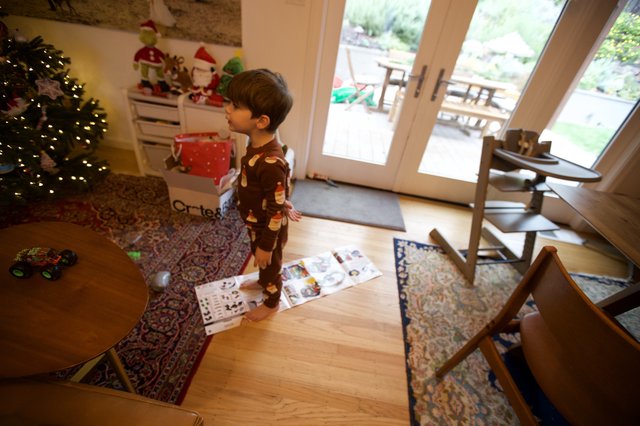 Christmas Morning Joy: Child Opening Presents