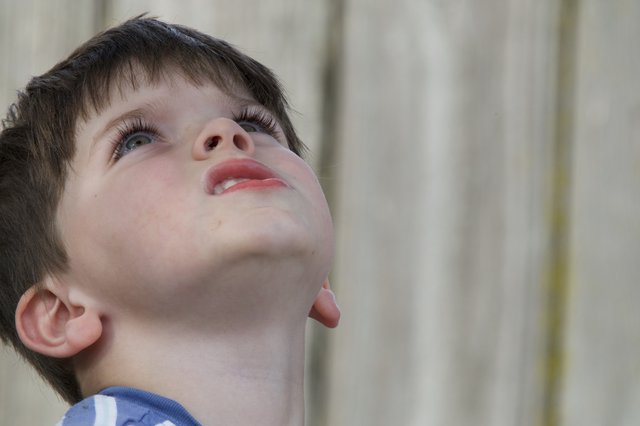 Young Boy Gazing Upward in Wonder