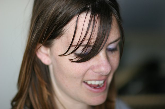 Candid Smile of a Young Woman with Freckles