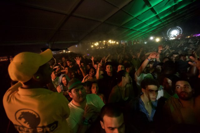 Yellow-Shirted Man in the Midst of the Coachella Crowd