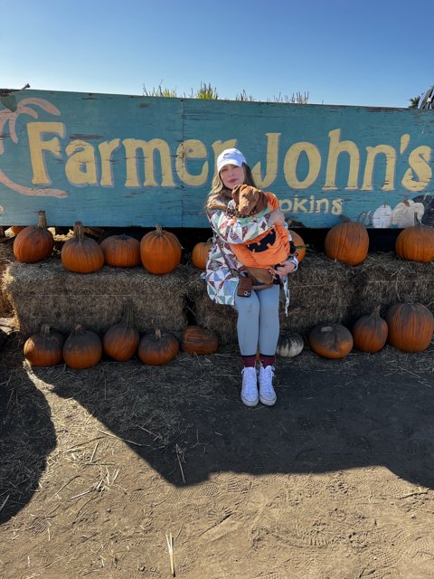 Portrait of a Smiling Teen in a Pumpkin Patch