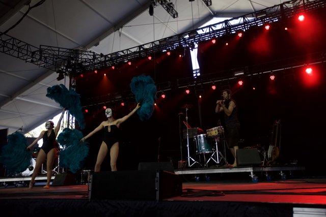 Blue Feathered Women Rock the Stage