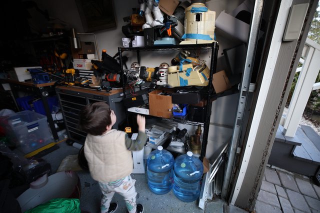 Child Organizing Tools in Cluttered Workshop Storage