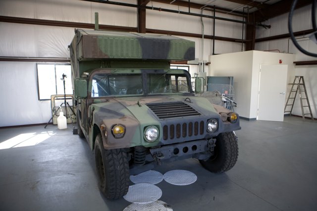 Military Jeep Parked in Garage