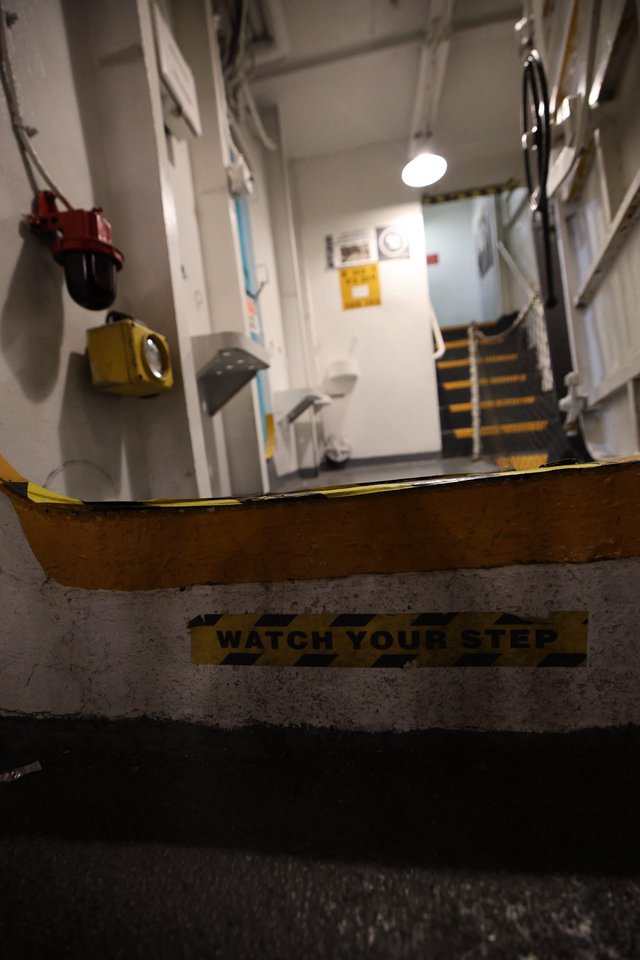 Watch Your Step Warning on USS Hornet Naval Vessel