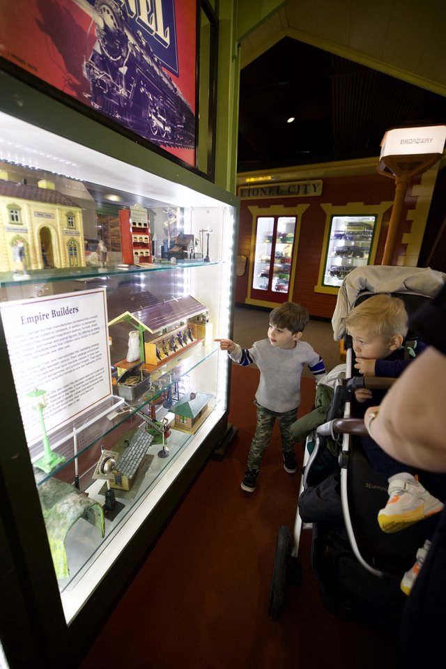 Young Visitors Explore Model Train Display at Museum