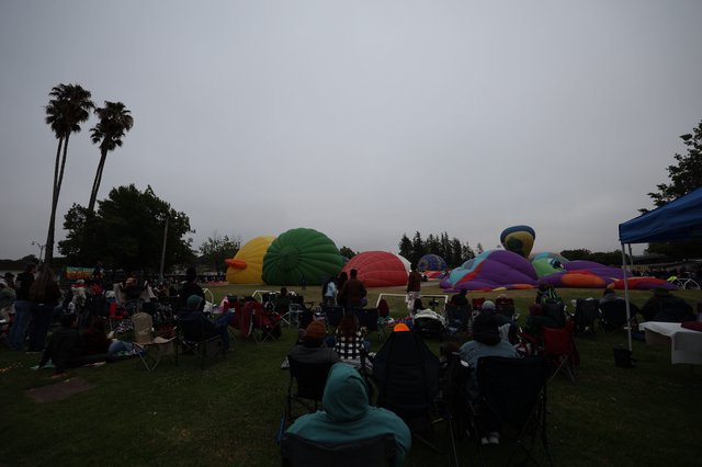 Hot Air Balloons Inflate at Dawn Balloon Festival