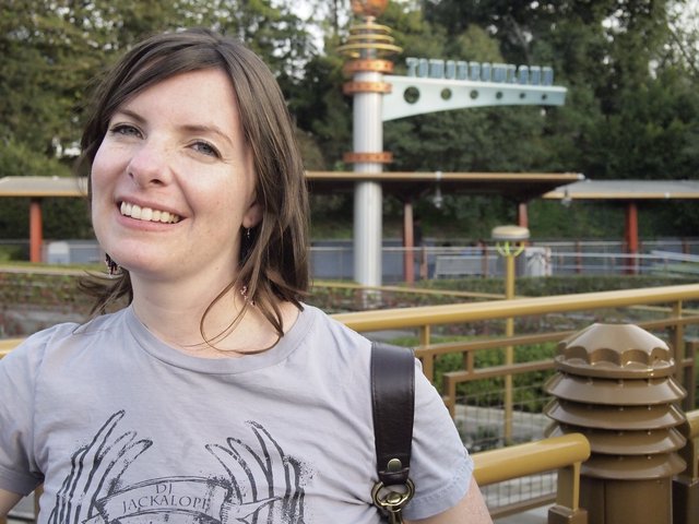Smiling Woman at Tomorrowland Disneyland Entrance