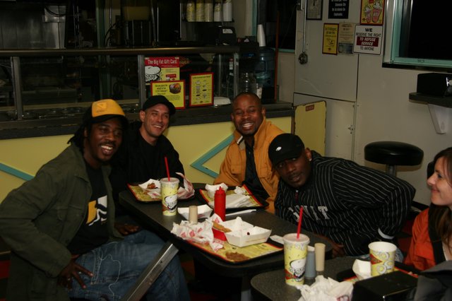 Friends Laughing Over Fast Food Late Night
