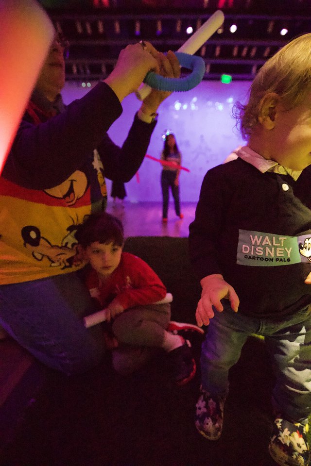 Children Playing with Light Toys at Baby Rave Event