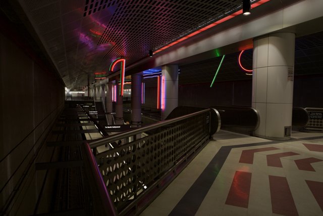 Neon-lit Corridor at Train Station