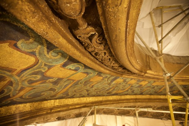 Golden and Blue Vaulted Ceiling in a Temple Theater