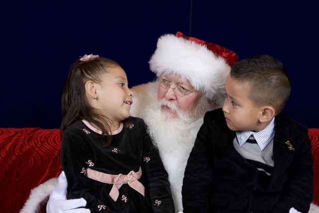 Santa Claus Brings Joy to Two Children