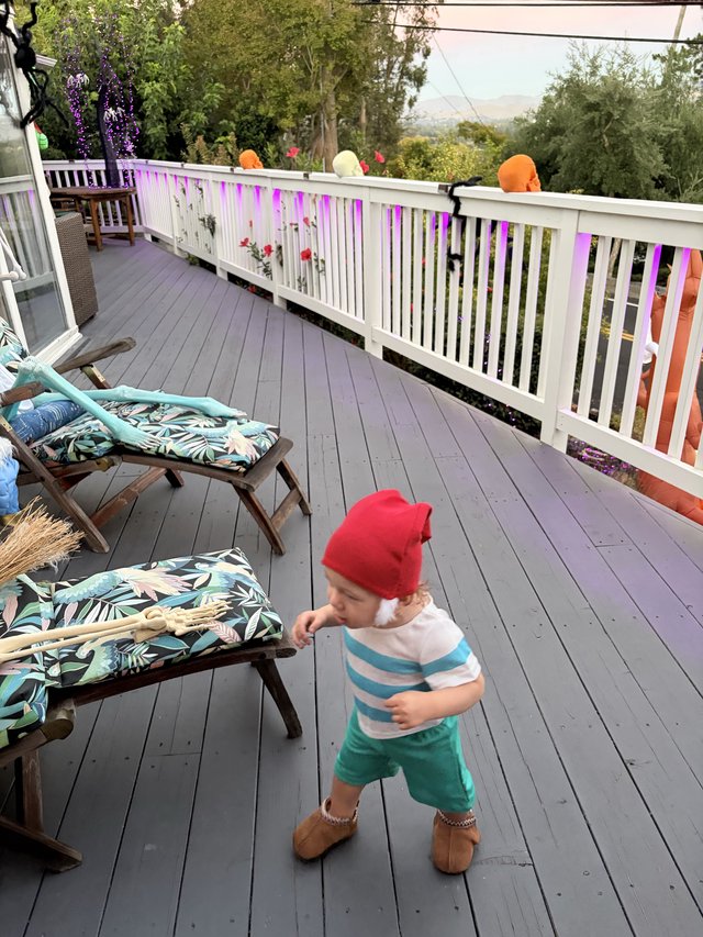 Toddler Dancing on Foggy Morning Deck