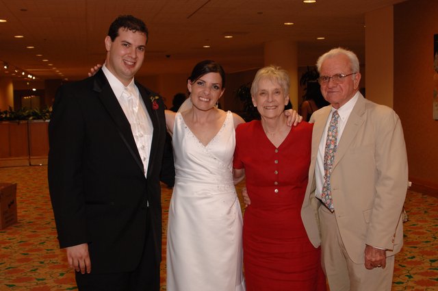 Newlyweds Pose with Family at Wedding Reception