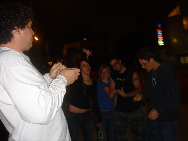 Late Night Street Magic Trick Captivates Small Crowd