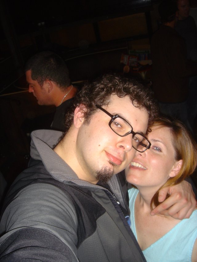 Dave and Penelope Share a Close Moment at a Bar