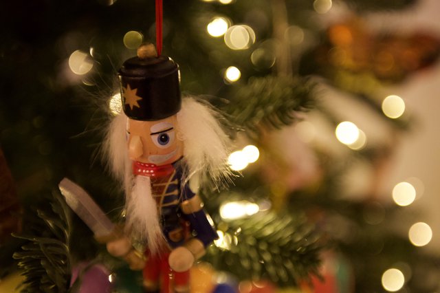 Nutcracker Ornament on Illuminated Christmas Tree