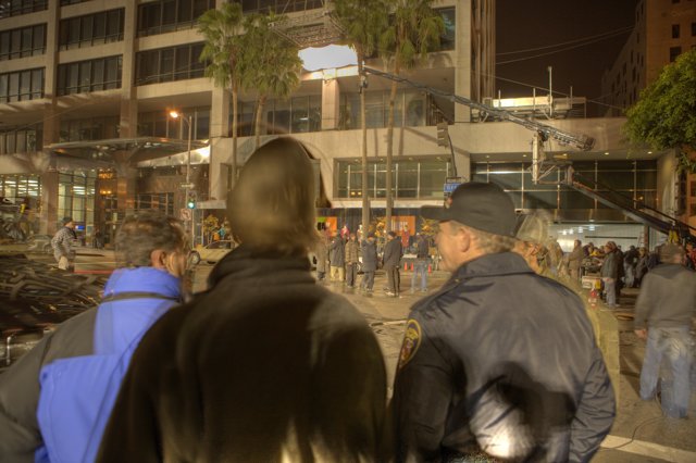 Nighttime Crowd Gathers in Metropolis