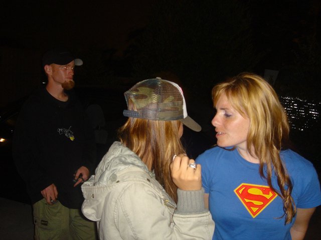 Night Gathering Friends in Superman Shirt Outdoors