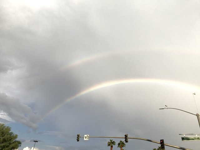 Double Rainbow Shines Over Urban Light