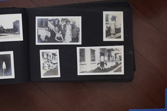 Family Photo Collage with Famous Faces Caption: A 2012 photo album belonging to the Bullock Curtis family showcases a black and white collage of 15 people, including famous figures like Florence Foster Jenkins and Alfonsina Storni. The album is framed as art and features portraits with 3 hats, capturing the clothing and head of each individual. Located in Bakersfield, California, this album is like an art gallery with its painting-like qualities and poster-like appearance.