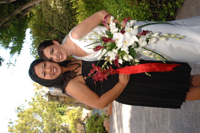 Bride and Bridesmaid Share Joyful Wedding Day Moment