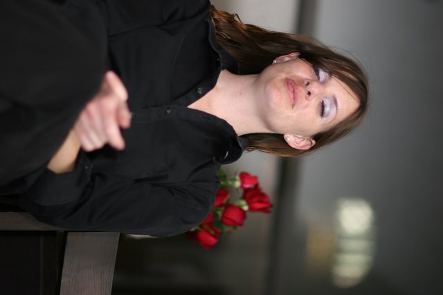 Penelope in Quiet Contemplation with Red Roses