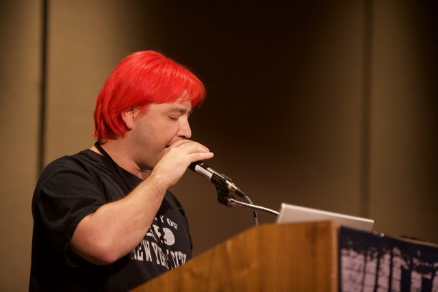 Red-Haired Man with a Microphone