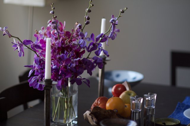 Elegant Purple Flower Arrangement with Candles