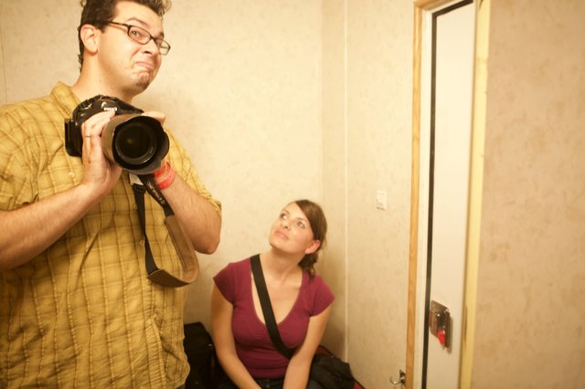 Photographers at Work in Hallway Mirror