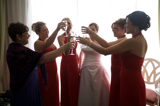 Elegant Toasting in Red Dresses