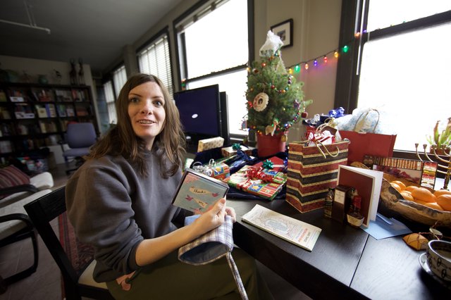 Woman Celebrates Christmas Morning with Gifts and Cards