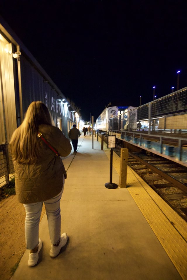 Evening Walk Along Historic Train Platform at Night