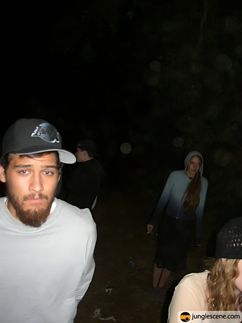 Nighttime Portrait of Four People with Baseball Caps