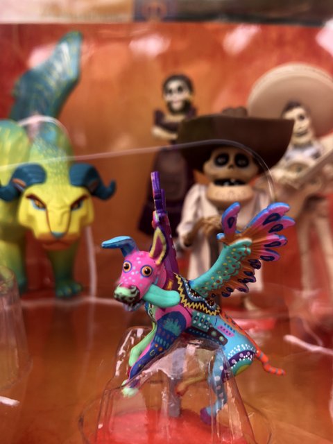 Colorful Figurine Duo: A Skeleton and His Trusty Steed