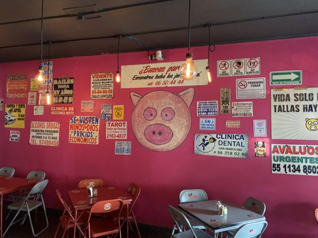 Pink Cafe with Colorful Signs