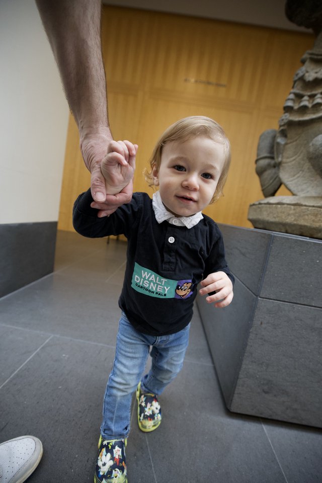 Toddler Holding Adult's Hand at Asian Art Museum