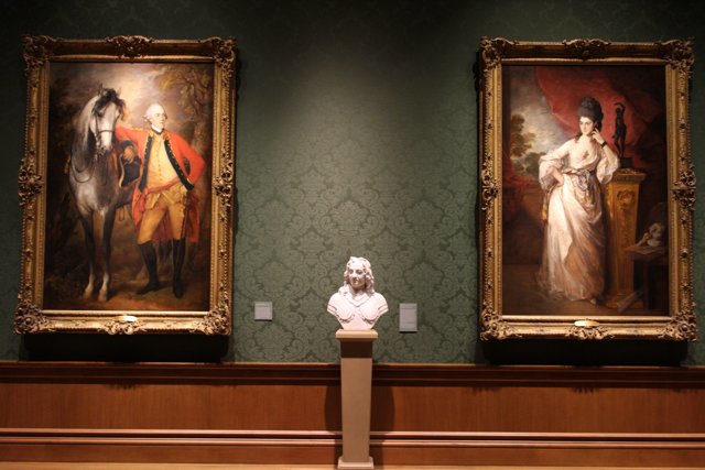 Portraits in Frames with a Bust of a Man