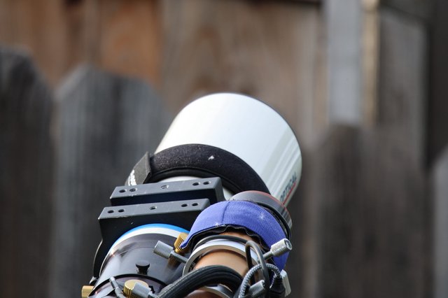Close-Up of Camera Lens with Blue Hood Attachment