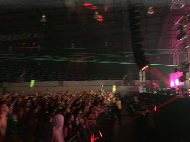 Green Lights and a Crowd at a Nightclub Concert in San Bernardino