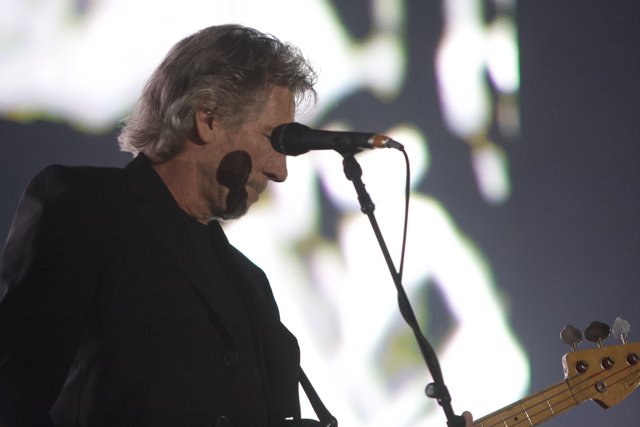 Bass Player in Black Suit Performing at Coachella