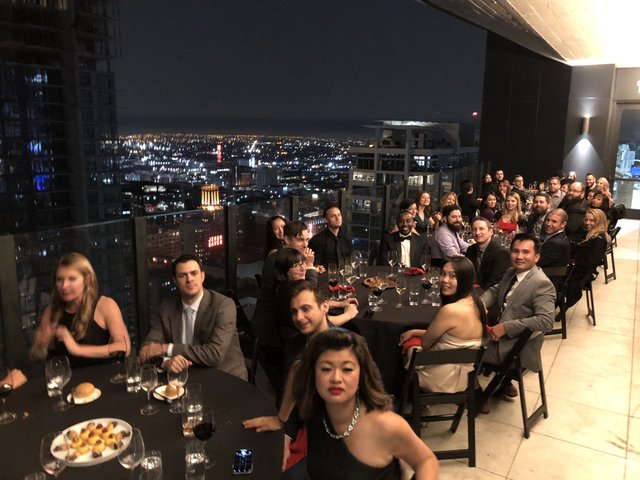 Elegant Rooftop Gala Dinner with City Skyline