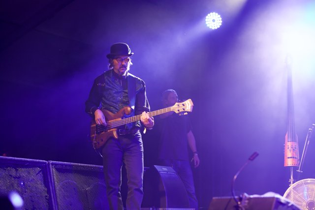 Les Claypool Shreds on Stage with His Guitar