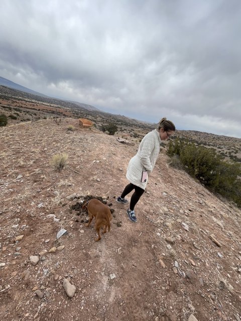 A Woman and Her Canine Companion Explore the Trails in Sandia Park