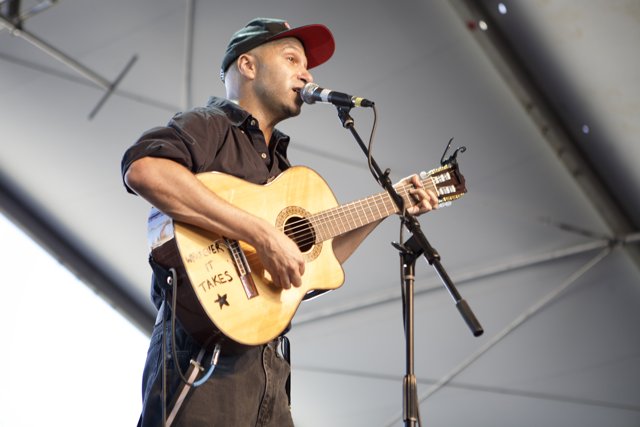 Tom Morello Rocks Coachella Stage with Electric Guitar and Microphone