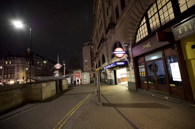 Empty London Street at Night with Underground Station
