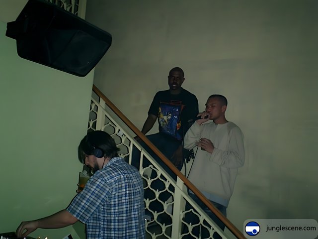 Three Men and a DJ on the Stairs
