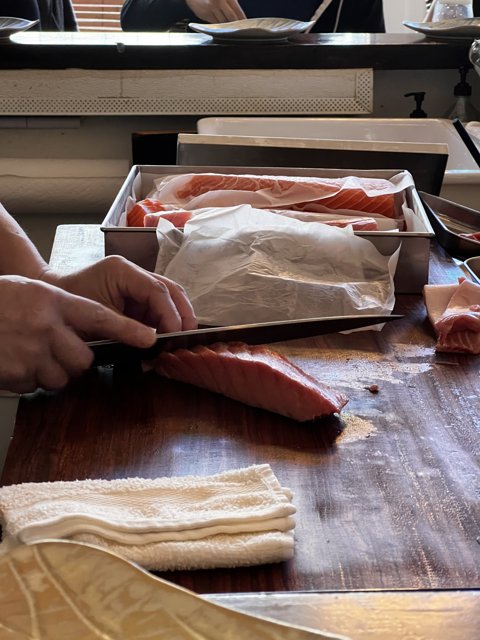 A Person Expertly Prepares Meat in San Francisco